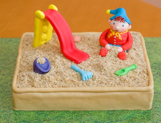 obrázek dortu - dort Pískoviště s klouzačkou a Noddym